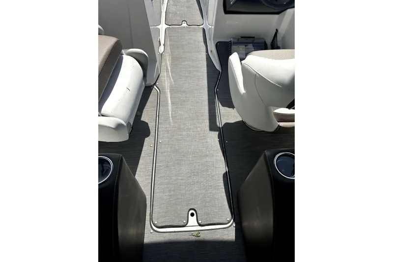 Slide: The Image of Interior view of a 2020 Scarab 255 ID boat, featuring seating and flooring. - 20