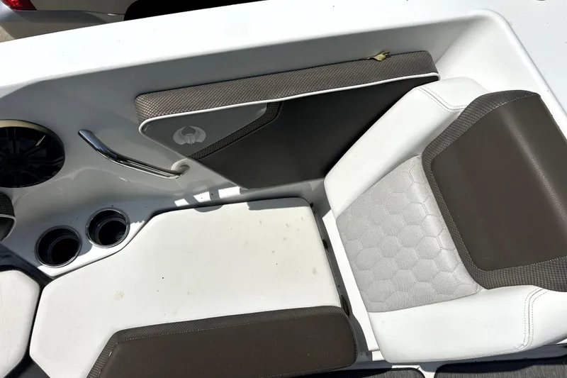 Slide: The Image of Interior seating of 2020 Scarab 255 ID boat with cup holders and speaker. - 23