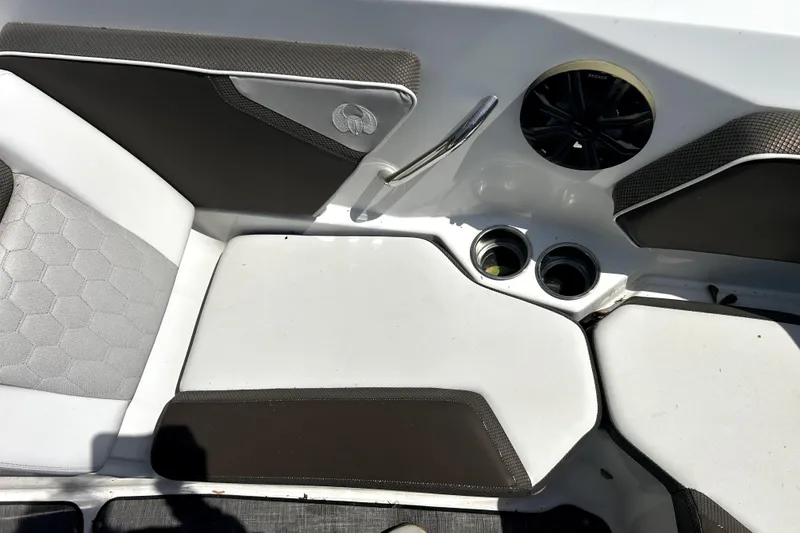 Slide: The Image of Interior seating of 2020 Scarab 255 ID boat with cup holders and speaker. - 24