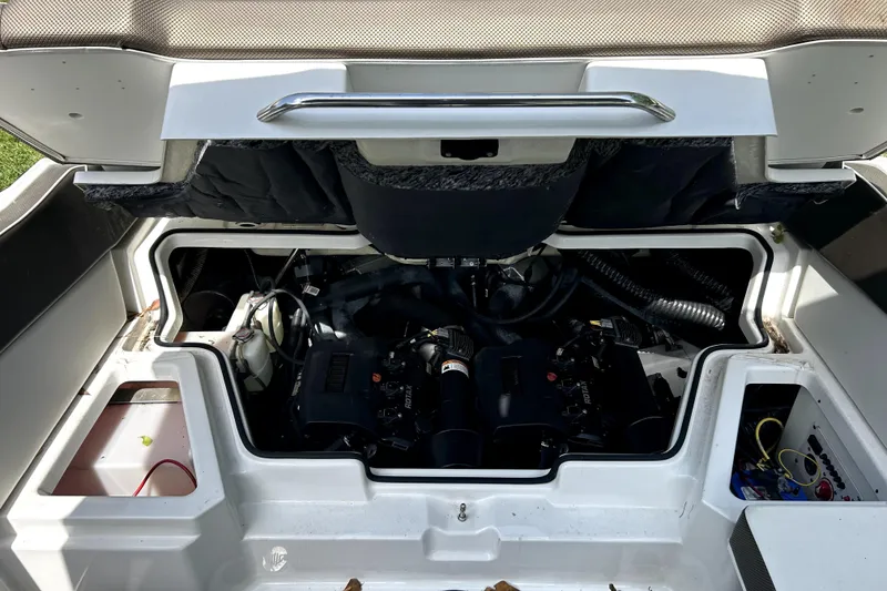 Slide: The Image of Open engine compartment of a 2020 Scarab 255 ID boat, showcasing internal components. - 30