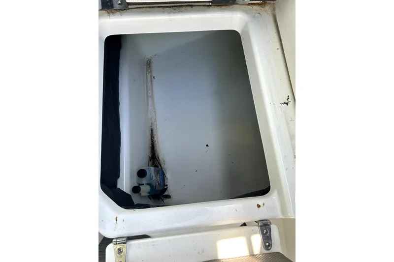Slide: The Image of Open storage compartment in 2020 Scarab 255 ID boat, showing interior details. - 40