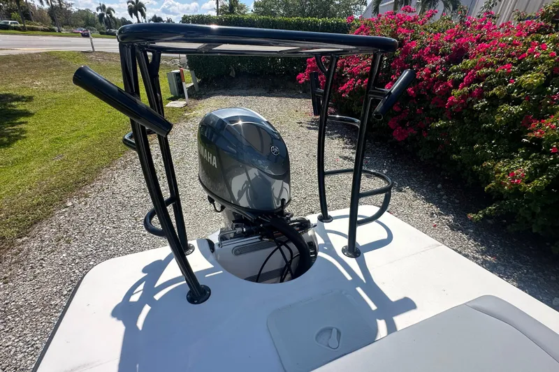 Slide: The Image of Delta D18 boat with Yamaha engine, surrounded by vibrant flowers and greenery. - 17