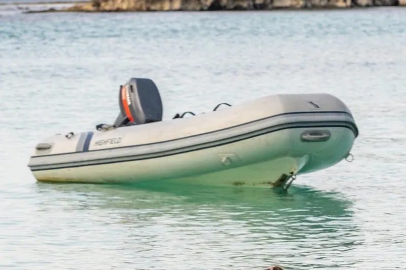 Slide: The Image of Manufacturer Provided Image: 2025 Highfield Ultralite 240 inflatable boat on calm water. - 2