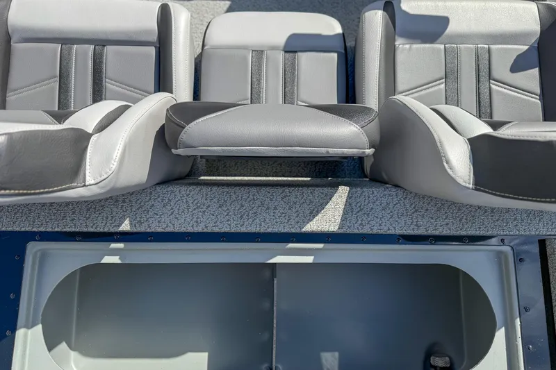 Slide: The Image of 2026 G3 Sportsman 1810 boat interior with gray seating and storage compartment. - 11