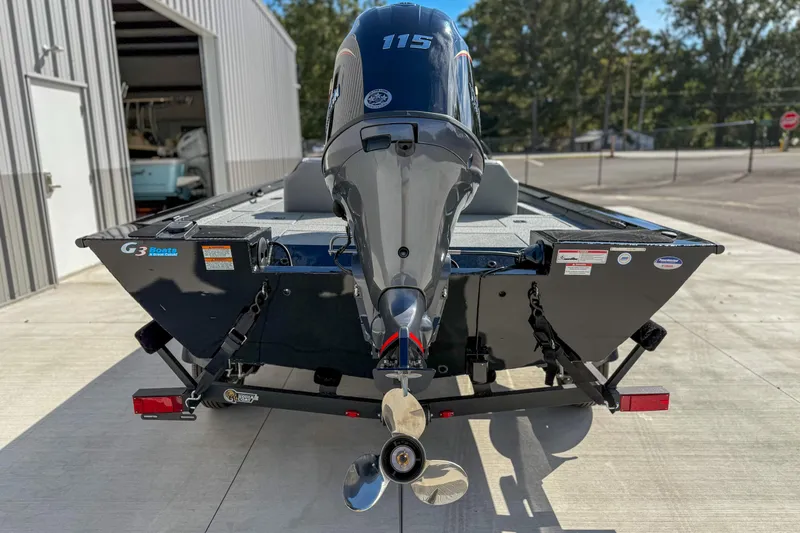 Slide: The Image of 2026 G3 Sportsman 1810 boat with powerful outboard motor, parked outdoors. - 12