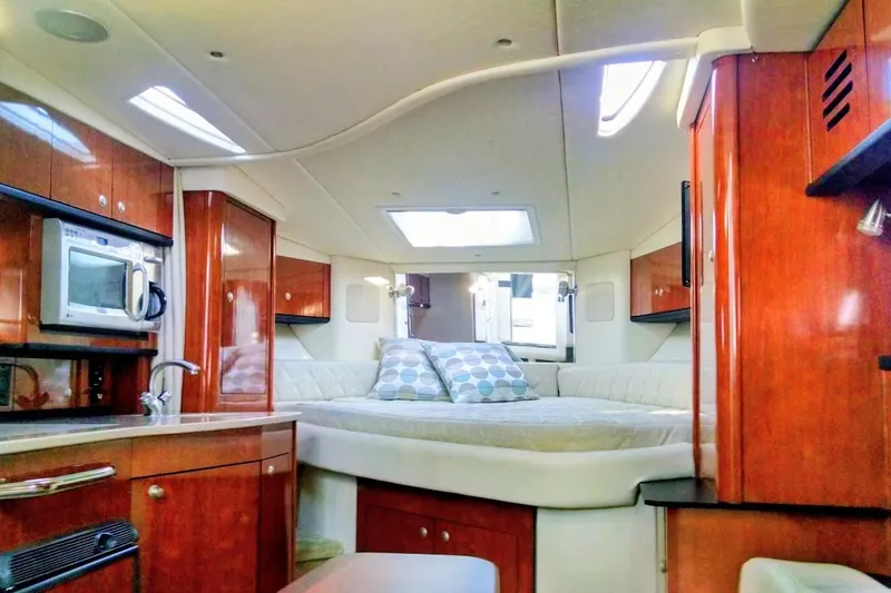 Slide: The Image of Luxurious interior of 2007 Sea Ray Sundancer 310 yacht with cozy bed and kitchenette. - 10