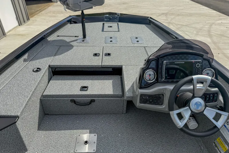 Slide: The Image of 2026 G3 Sportsman 1710 boat interior with steering wheel and control panel. - 10