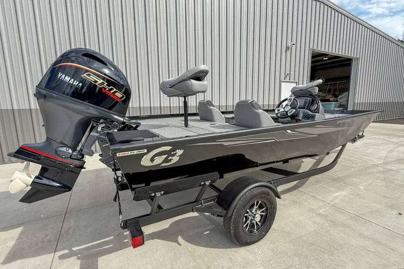 Slide: The Image of 2026 G3 Sportsman 1710 boat with Yamaha engine on trailer, parked outside a building. - 3