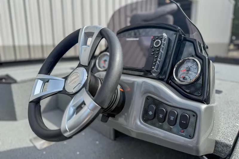 Slide: The Image of 2026 G3 Sportsman 1710 boat dashboard with steering wheel and gauges. - 6