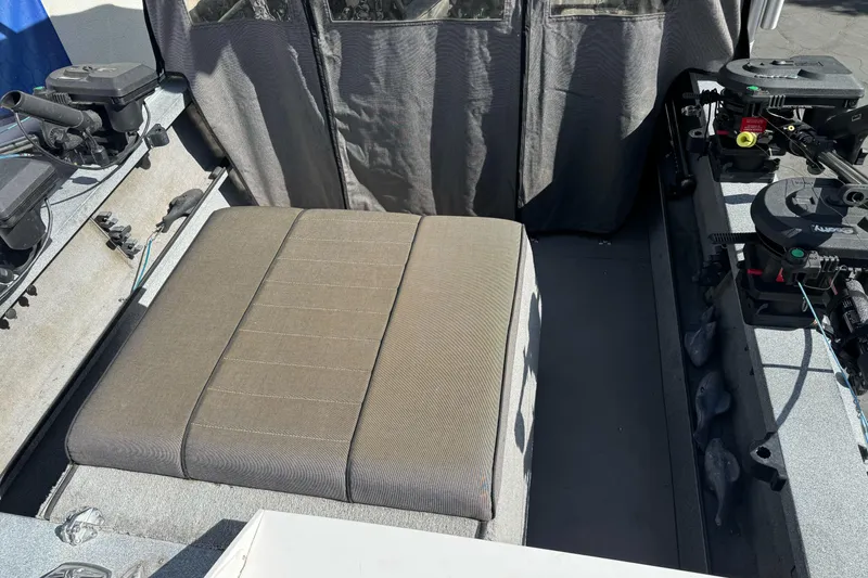 Slide: The Image of 2006 Alumaweld Stryker Sport 19 interior with seating and fishing equipment. - 10