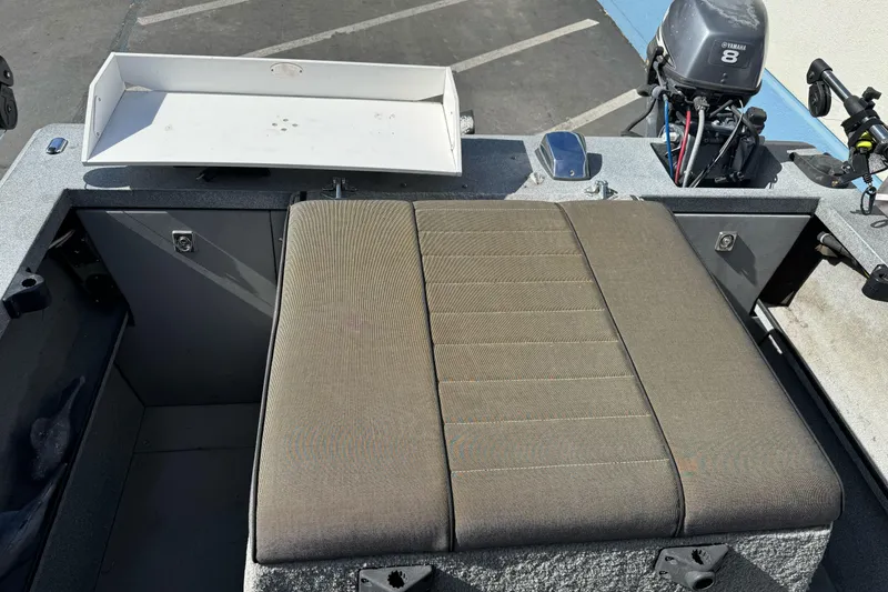 Slide: The Image of 2006 Alumaweld Stryker Sport 19 boat interior with seating and motor. - 14