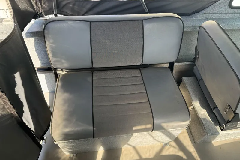 Slide: The Image of 2006 Alumaweld Stryker Sport 19 boat interior seating, gray upholstery. - 19