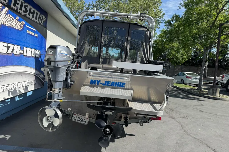 Slide: The Image of 2006 Alumaweld Stryker Sport 19 boat with Yamaha outboard motor, parked outdoors. - 3