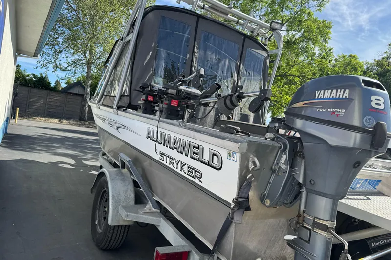 Slide: The Image of 2006 Alumaweld Stryker Sport 19 boat with Yamaha outboard motor in driveway. - 5