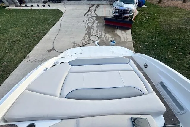 Slide: The Image of 2013 Rinker 246 Captiva Bowrider boat on driveway, rear view. - 16