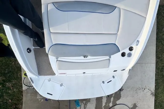 Slide: The Image of 2013 Rinker 246 Captiva Bowrider boat interior with cushioned seating and swim platform. - 17