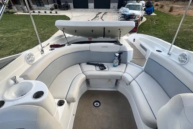 Slide: The Image of 2013 Rinker 246 Captiva Bowrider with spacious seating and storage compartments. - 18