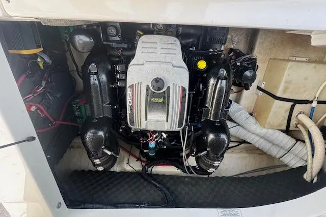 Slide: The Image of Engine compartment of a 2013 Rinker 246 Captiva Bowrider boat. - 21