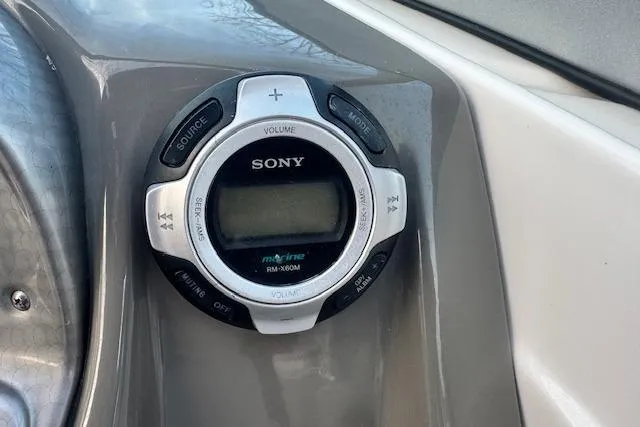 Slide: The Image of Sony marine audio control on 2013 Rinker 246 Captiva Bowrider dashboard. - 25
