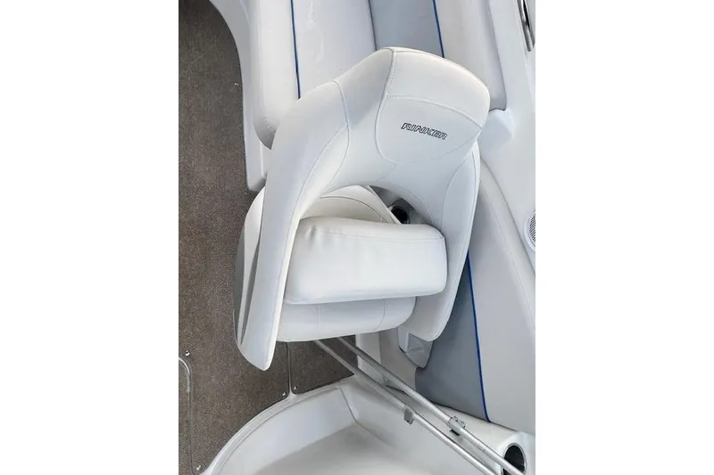Slide: The Image of 2013 Rinker 246 Captiva Bowrider white leather seat, showcasing luxury boat interior design. - 26