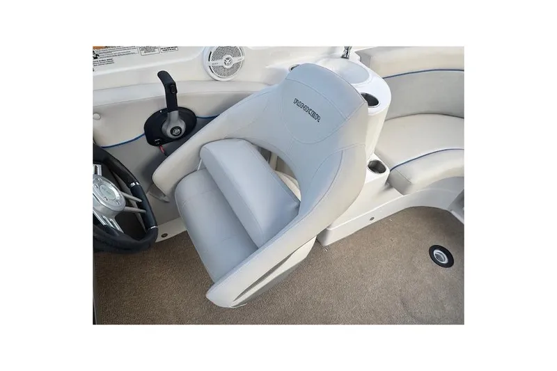 Slide: The Image of 2013 Rinker 246 Captiva Bowrider interior with steering wheel and seating. - 29