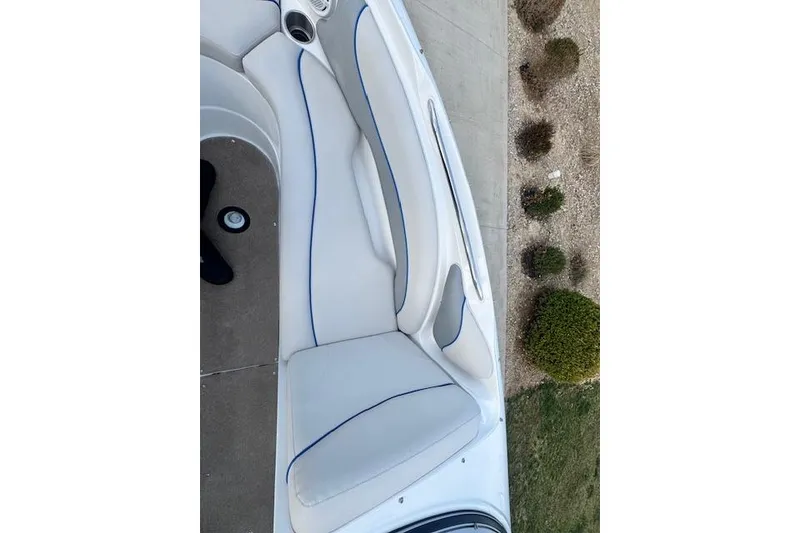 Slide: The Image of 2013 Rinker 246 Captiva Bowrider interior with white seating and blue trim. - 32