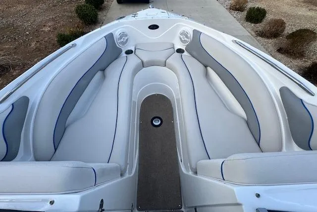 Slide: The Image of 2013 Rinker 246 Captiva Bowrider interior with spacious seating and sleek design. - 33