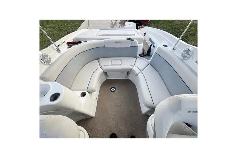 Slide: The Image of 2013 Rinker 246 Captiva Bowrider interior with white seating and carpeted floor. - 35