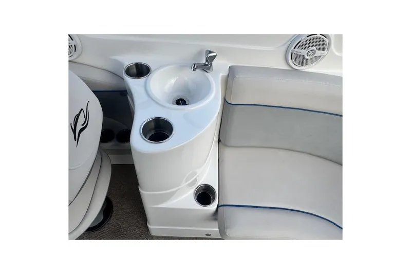 Slide: The Image of Interior of 2013 Rinker 246 Captiva Bowrider featuring sink and cup holders. - 36