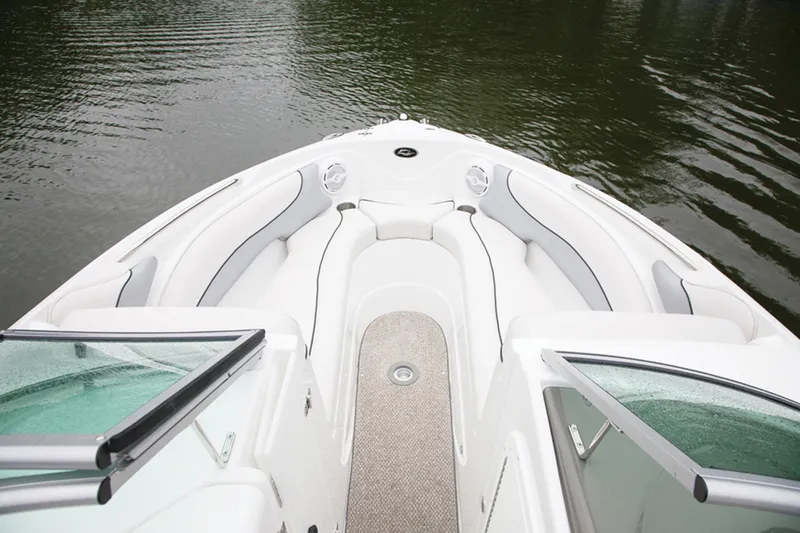 Slide: The Image of Manufacturer Provided Image: 2013 Rinker Captiva 246 BR boat interior with white and gray seating. - 38