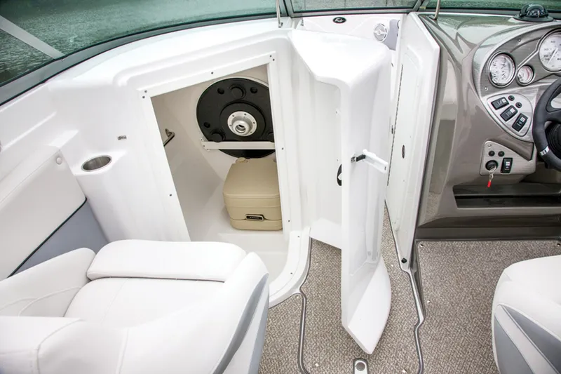 Slide: The Image of Manufacturer Provided Image: 2013 Rinker Captiva 246 BR boat interior with open storage compartment. - 39