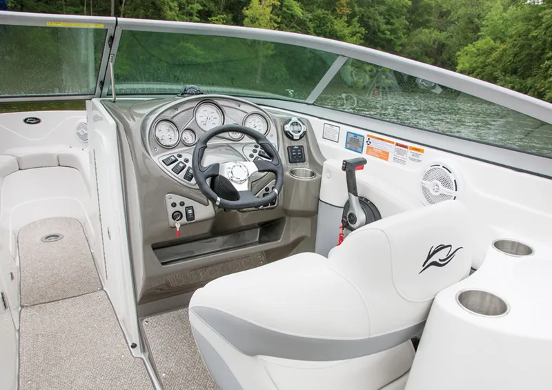 Slide: The Image of Manufacturer Provided Image: 2013 Rinker Captiva 246 BR boat interior with steering wheel and dashboard. - 40