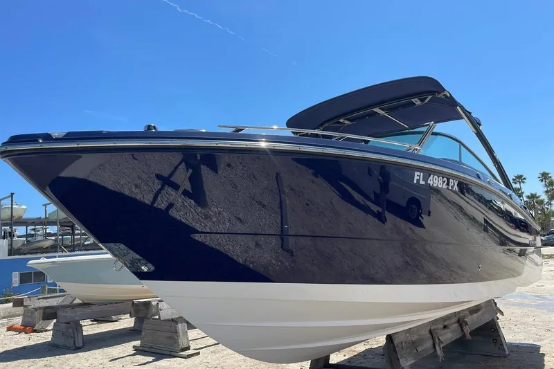 The Image of 2015 Monterey 268SS Super Sport boat on display under clear blue sky. - 0