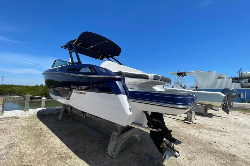 Slide: The Image of 2015 Monterey 268SS Super Sport boat on dry dock under clear blue sky. - 1