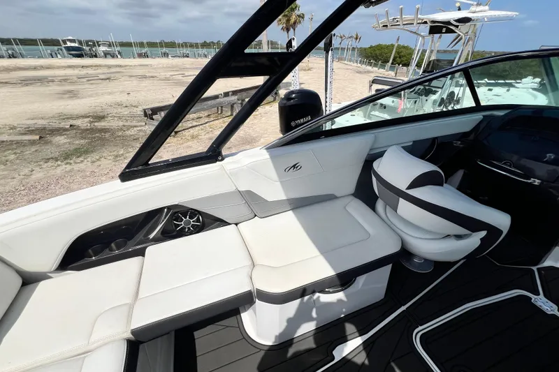 Slide: The Image of Interior of a 2015 Monterey 268SS Super Sport boat with white seating and black accents. - 34