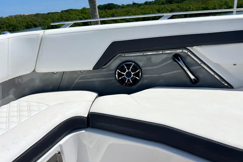 Slide: The Image of 2015 Monterey 268SS Super Sport boat interior with white seating and speaker detail. - 37