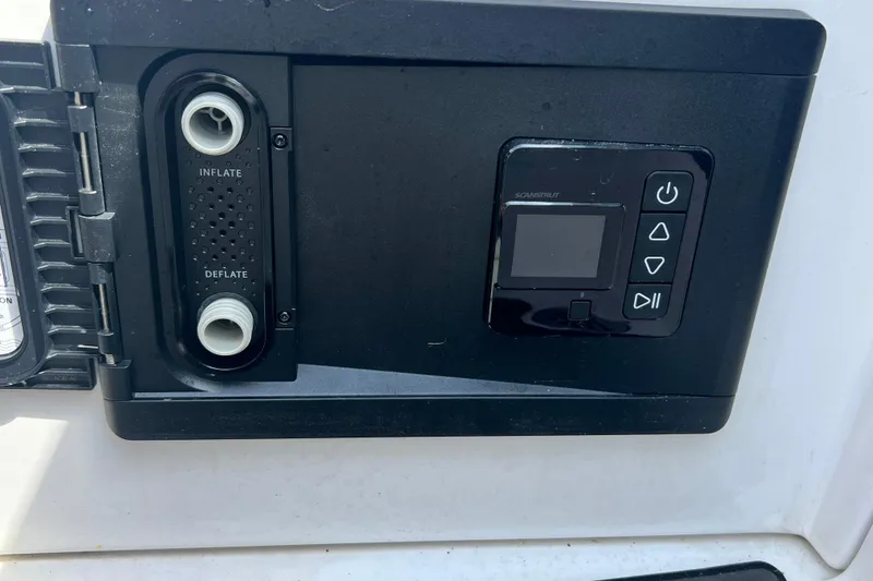 Slide: The Image of Control panel on a 2015 Monterey 268SS Super Sport boat, featuring inflate and deflate options. - 48