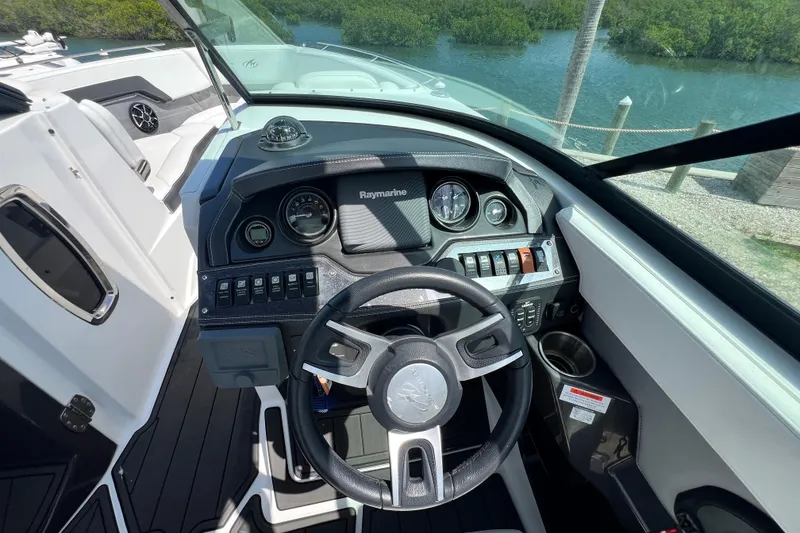 Slide: The Image of Cockpit view of a 2015 Monterey 268SS Super Sport boat with steering wheel and dashboard. - 50