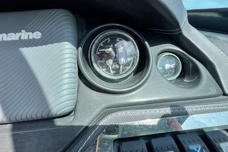 Slide: The Image of Dashboard of a 2015 Monterey 268SS Super Sport boat with gauges and controls. - 52