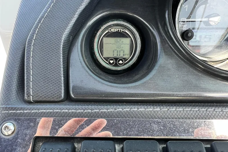 Slide: The Image of Dashboard of a 2015 Monterey 268SS Super Sport boat with depth gauge display. - 53