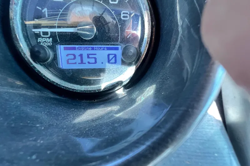 Slide: The Image of Close-up of a 2015 Monterey 268SS Super Sport engine hour meter showing 215 hours. - 54