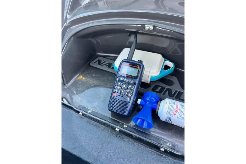 Slide: The Image of Storage compartment of 2015 Monterey 268SS Super Sport with radio and air horn. - 56