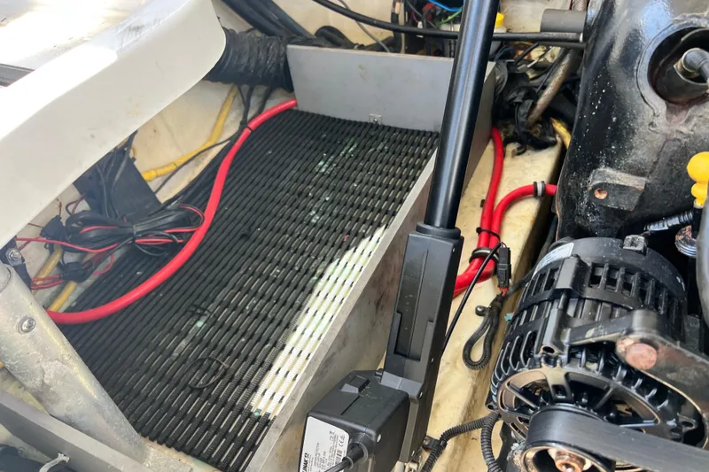 Slide: The Image of Engine compartment of a 2015 Monterey 268SS Super Sport boat, showing wiring and components. - 62