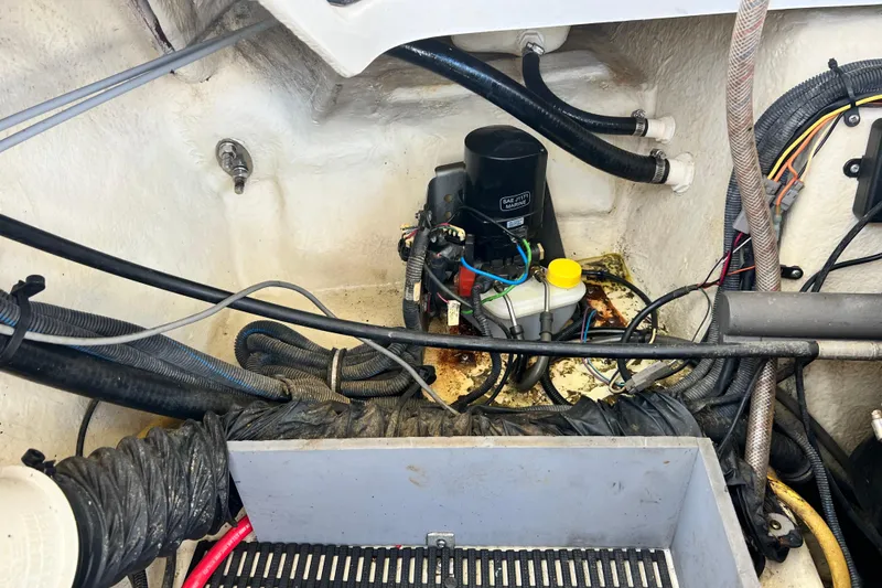 Slide: The Image of Engine compartment of a 2015 Monterey 268SS Super Sport boat, showing wiring and components. - 63