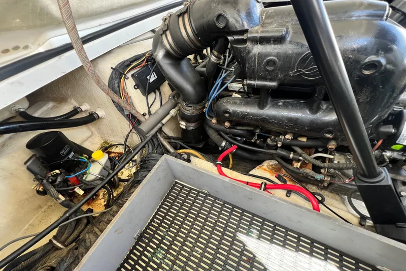Slide: The Image of Engine compartment of a 2015 Monterey 268SS Super Sport boat, showing mechanical components. - 64