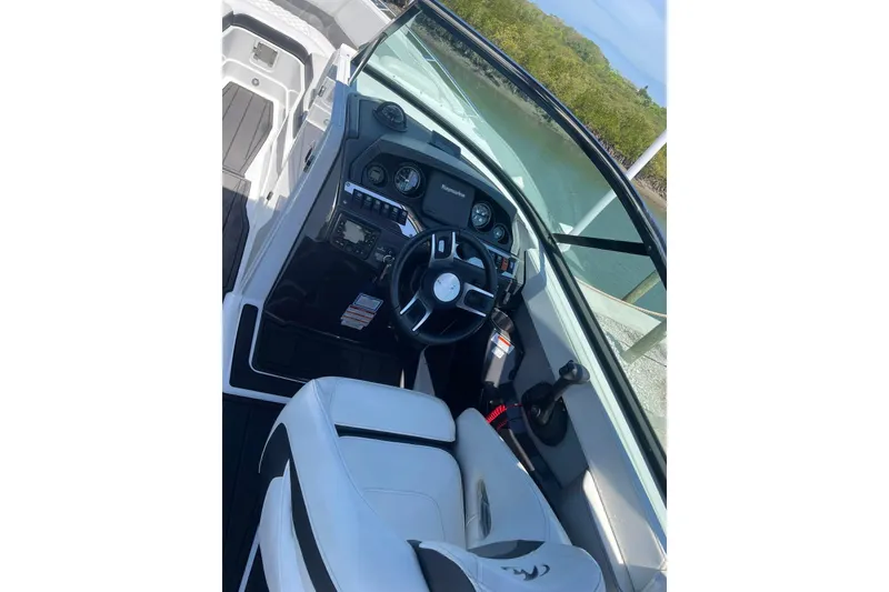 Slide: The Image of Interior view of 2015 Monterey 268SS Super Sport boat cockpit with steering wheel and controls. - 7