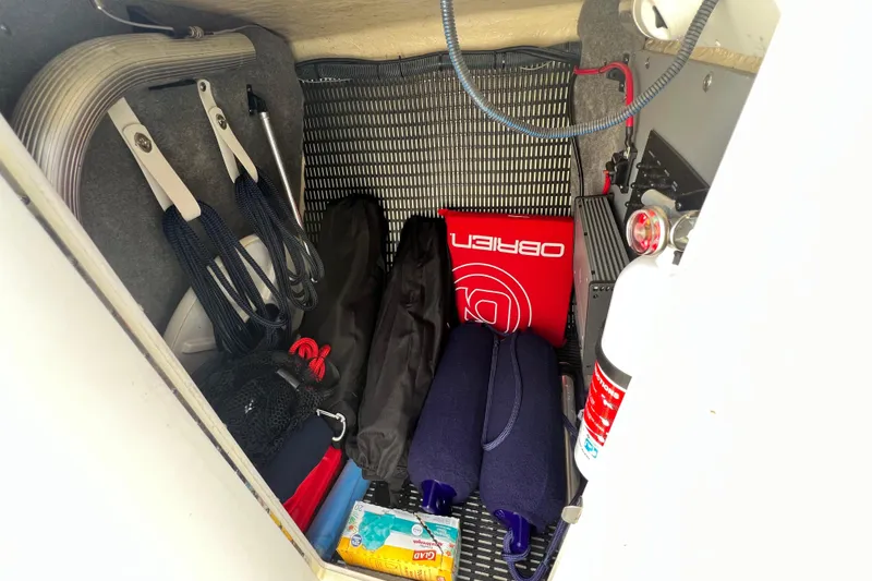 Slide: The Image of Storage compartment of a 2015 Monterey 268SS Super Sport boat with safety equipment. - 71