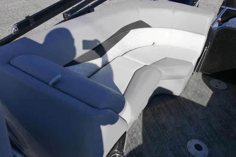 Slide: The Image of 2019 Manitou 25 Encore RF boat interior with gray and white seating. - 11