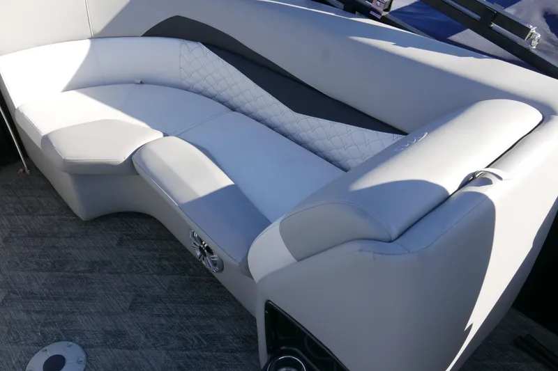 Slide: The Image of Luxurious seating on 2019 Manitou 25 Encore RF pontoon boat, featuring elegant upholstery. - 12