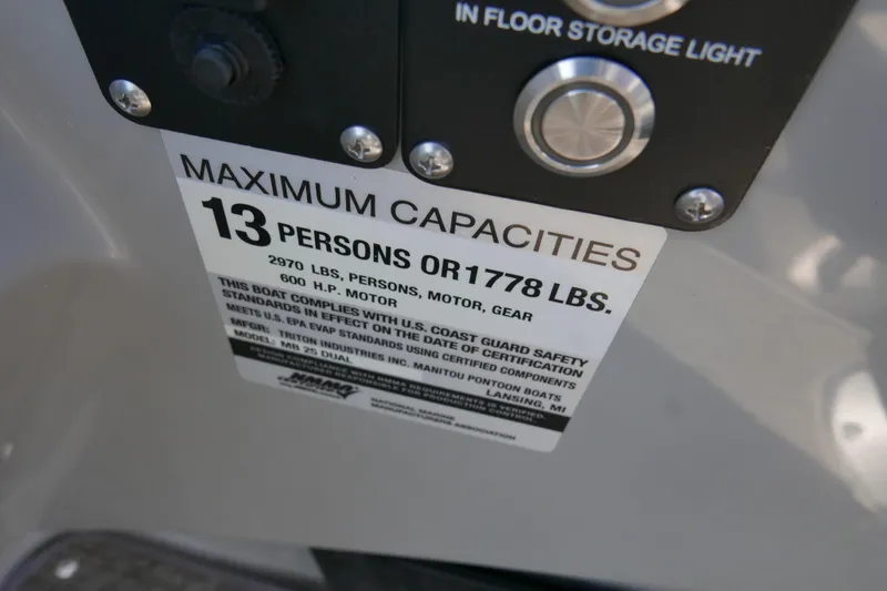 Slide: The Image of Capacity label on 2019 Manitou 25 Encore RF boat, max 13 persons or 1778 lbs. - 14